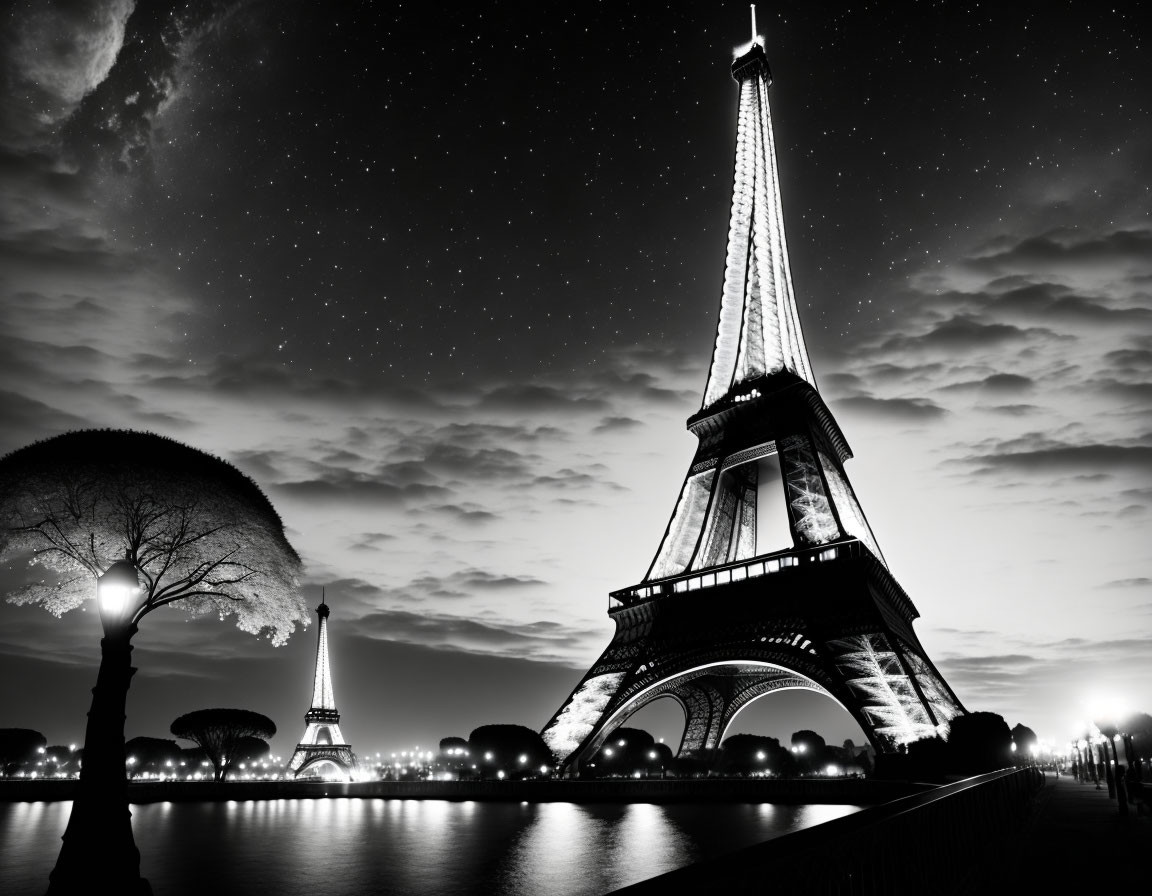 Nighttime Eiffel Tower photo with starry sky and water reflection