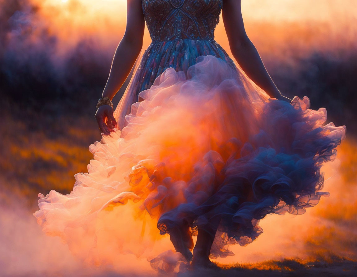 Woman in flowing dress blends with misty, orange backdrop