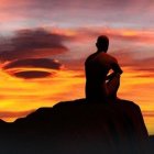 Person sitting on rock gazes at surreal landscape with orange waves and jagged mountains under amber sky