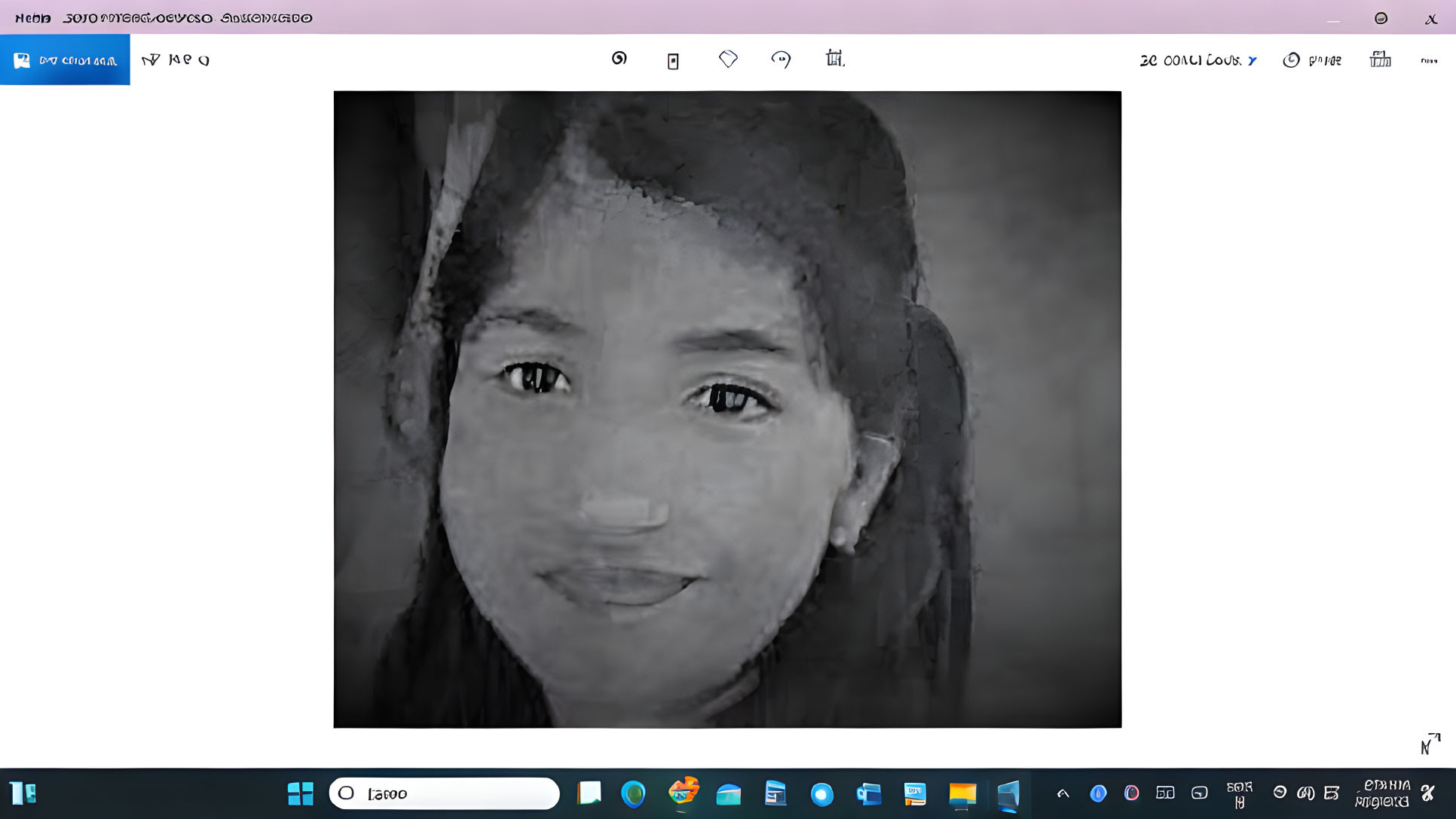 Monochrome portrait of smiling young girl in headscarf