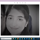 Monochrome portrait of smiling young girl in headscarf