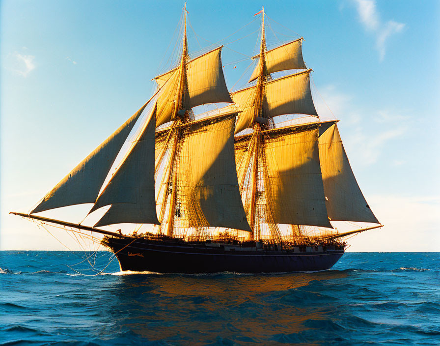 Tall Ship with Multiple Sails Sailing on Open Sea