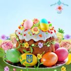 Vibrant Easter scene with decorated cake and eggs on grassy background