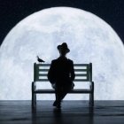 Person in hat gazes at large moon and planets from bench