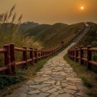 Tranquil sunset over sand dunes and wooden fence by serene bay