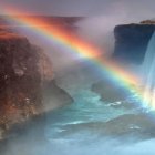 Tranquil Waterfall Oasis with Vibrant Rainbow