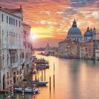 Iconic gondolas and historic architecture at sunset in Venice