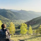 Autumn landscape with person overlooking vibrant valley