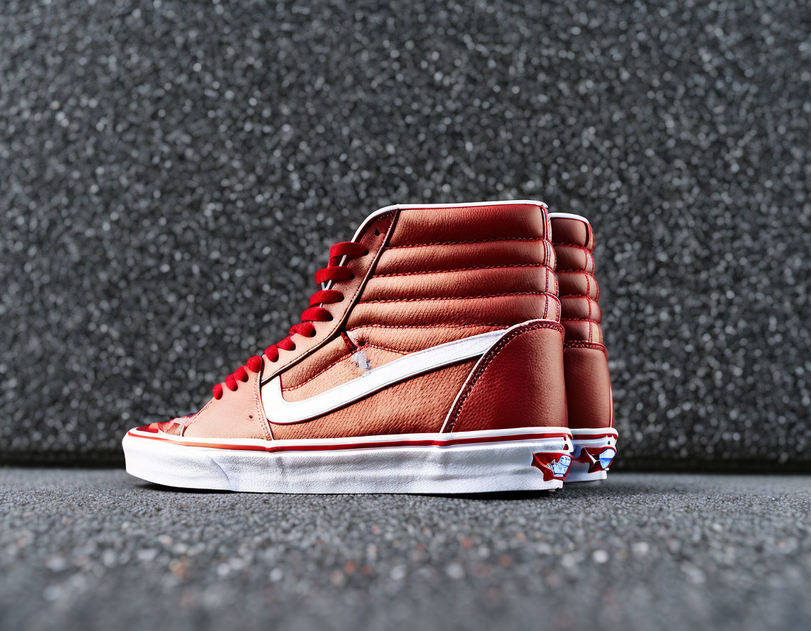 Brown High-Top Sneaker with Red Laces on Dark Textured Background