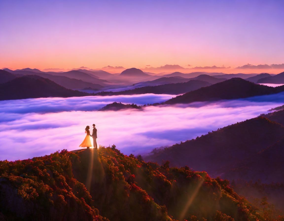 Couple on Mountain Above Clouds at Sunrise