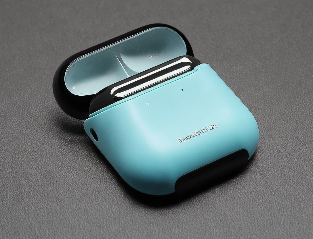 Turquoise Wireless Earbud Case Open on Grey Background