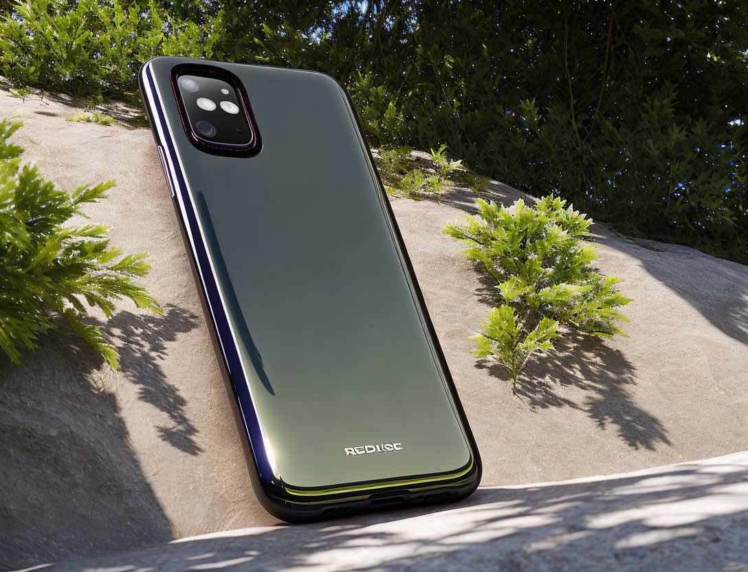 Reflective Green Triple Camera Smartphone on Stone Surface