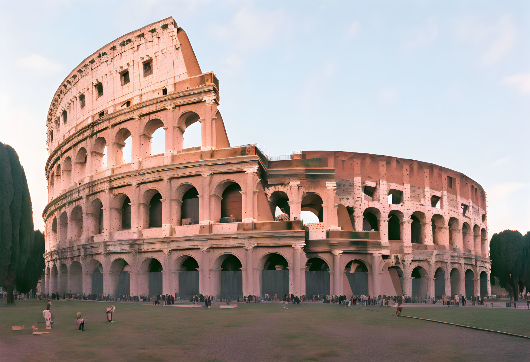 Ancient Colosseum at Dusk with Visitors in Rome