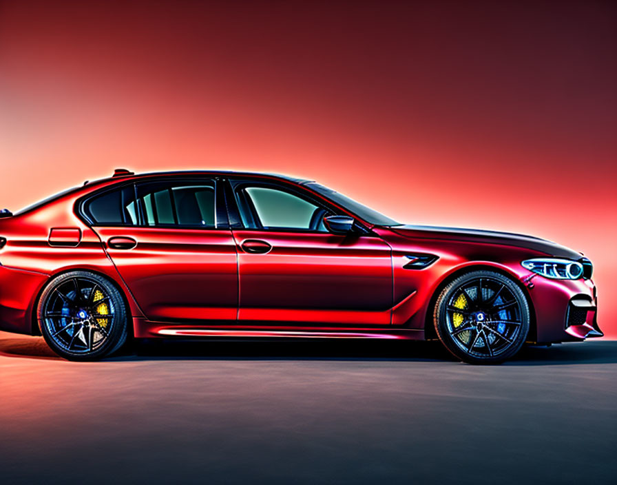 Red sports sedan with sleek body lines on red gradient background