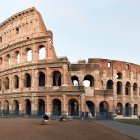 Ancient Colosseum at Dusk with Visitors in Rome