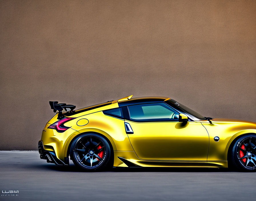 Yellow Sports Car with Black Roof and Spoiler Parked Beside Beige Wall