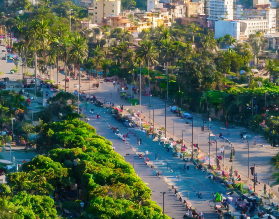 Urban street scene with lush green trees and pedestrians in soft focus