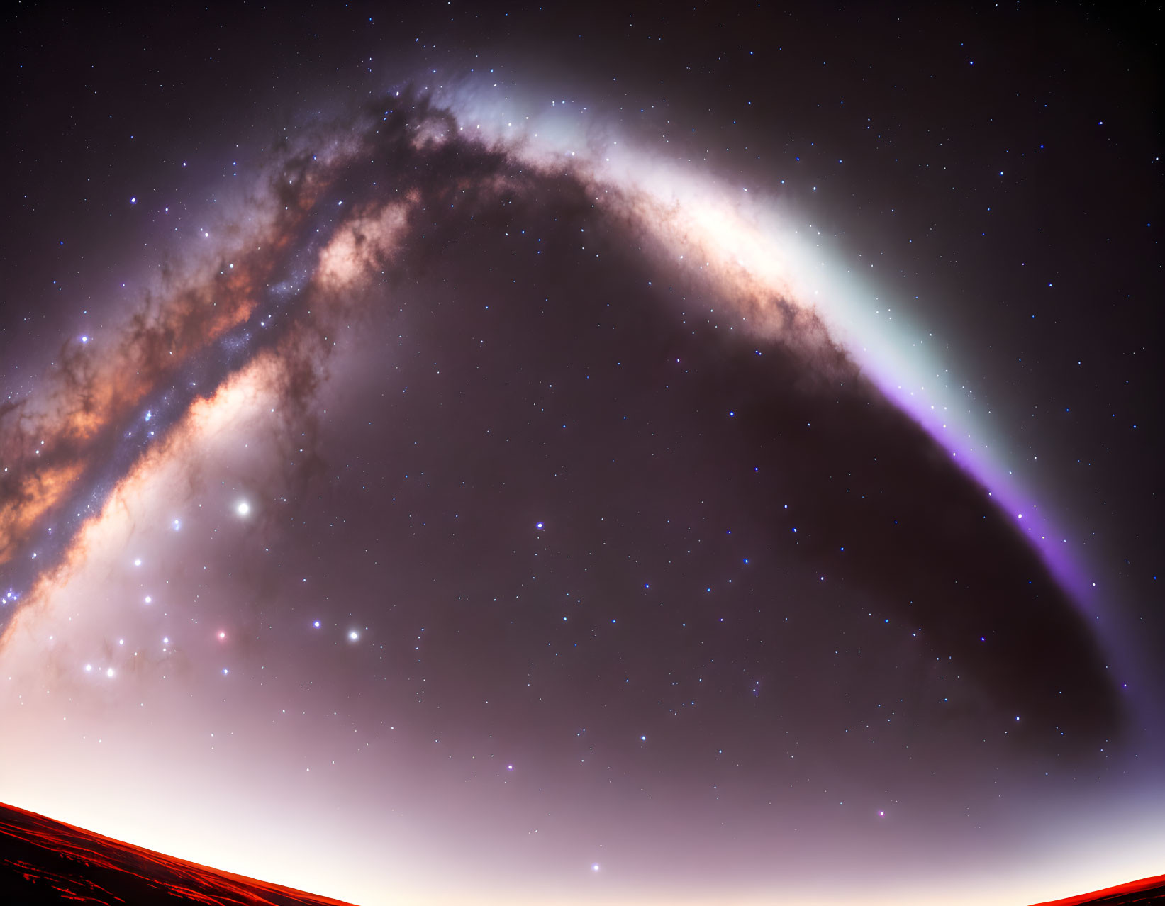 Starry night sky with Milky Way arching over silhouetted horizon