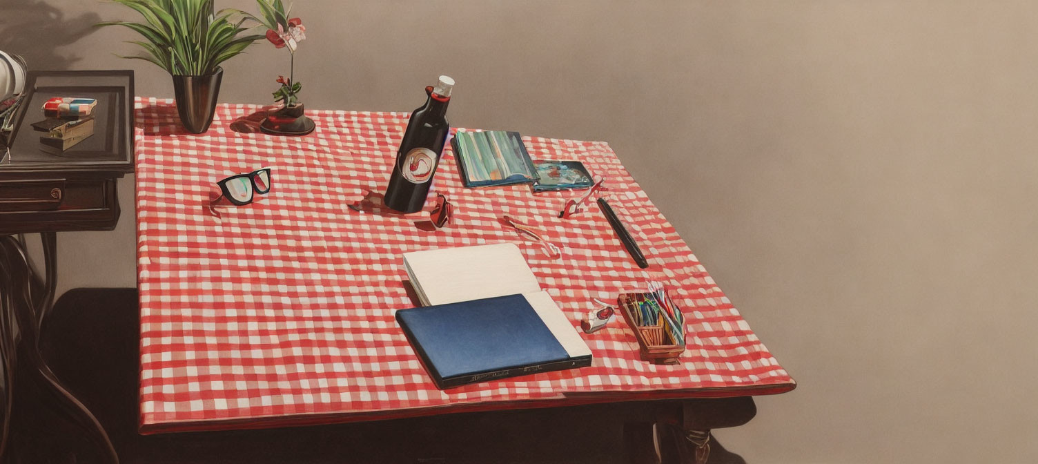 Neatly organized table with red & white checkered tablecloth & various items