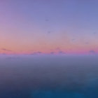 Tranquil Ocean Scene at Twilight with Birds in Flight