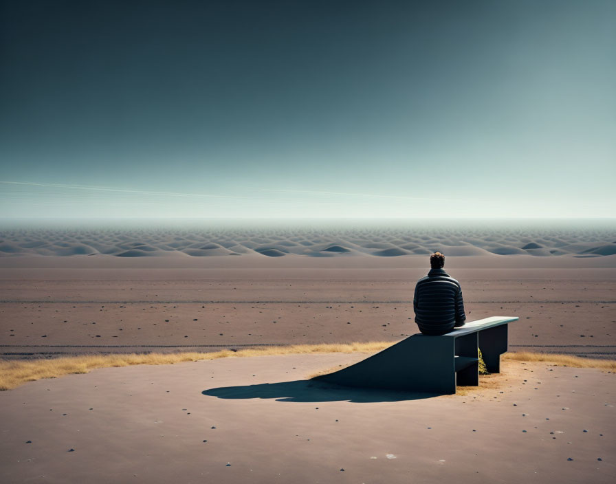 Solitary figure on bench gazes at expansive sand dunes under clear sky