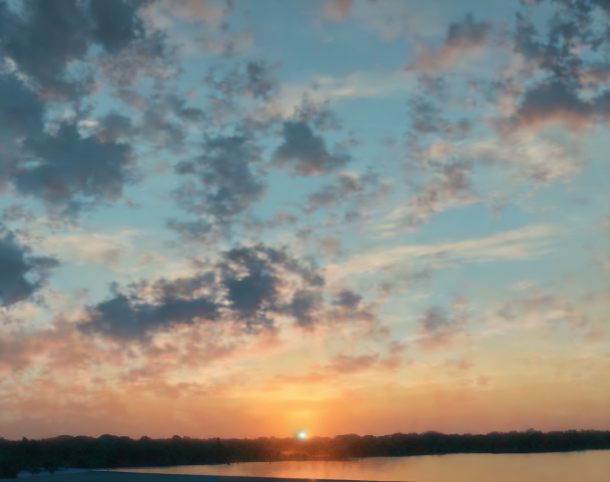 Tranquil sunrise over calm lake under soft blue sky