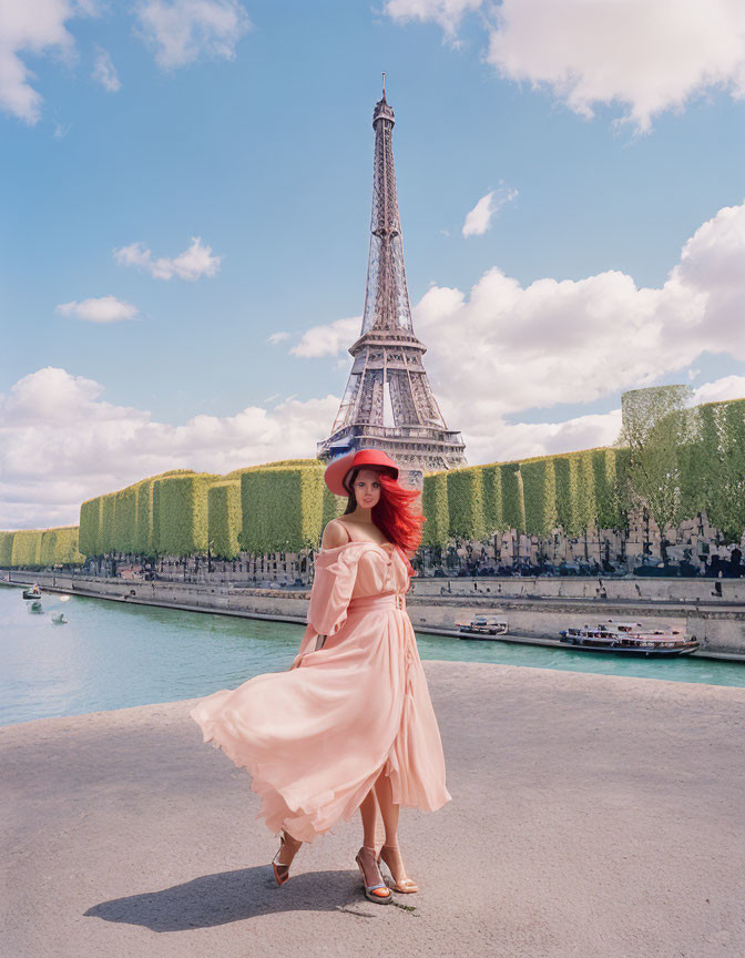 Woman in Pink Dress and Hat at Eiffel Tower with River and Sky