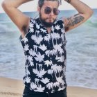 Bearded man with slicked-back hair covered in white paint at Eiffel Tower