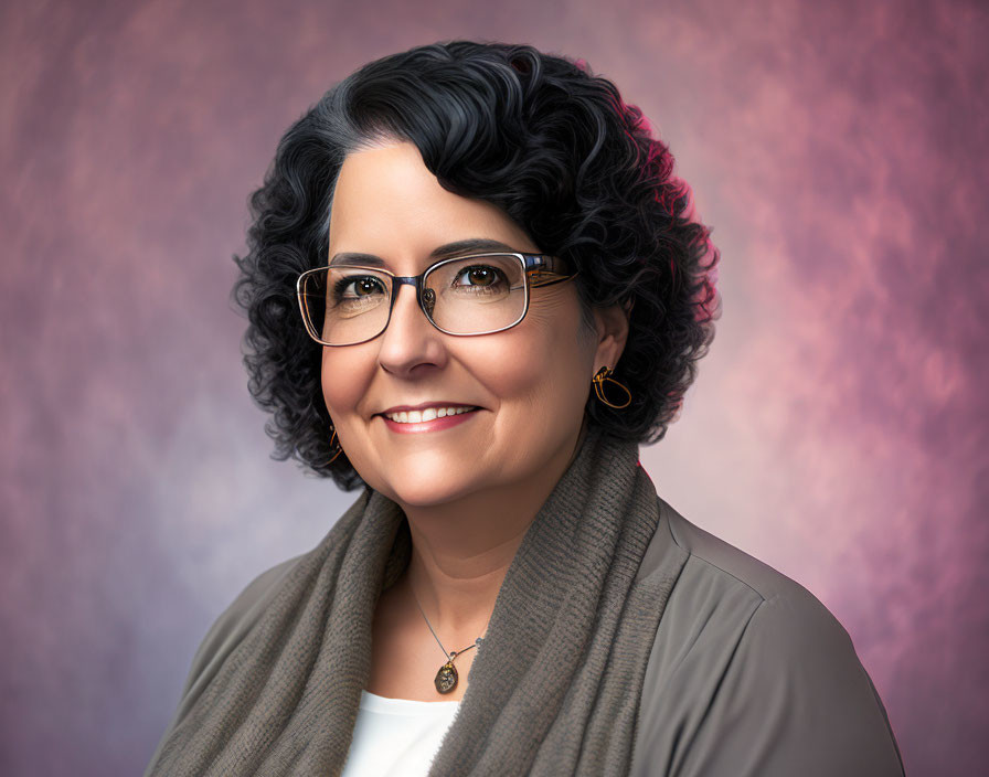 Curly-Haired Woman Smiling in Glasses on Pink Background