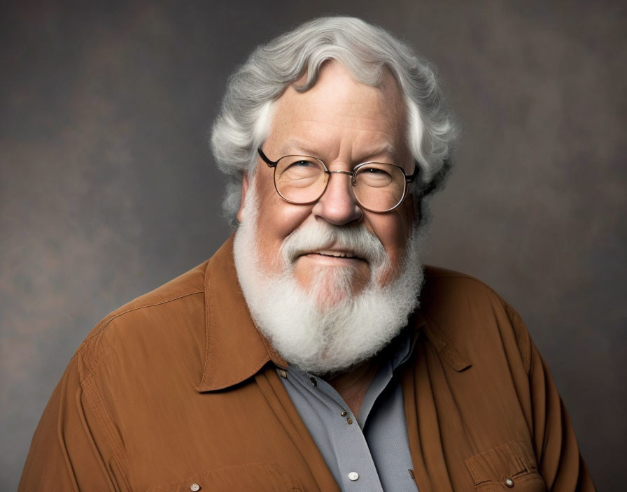 Elderly Man with White Beard, Glasses, and Brown Shirt Smiling