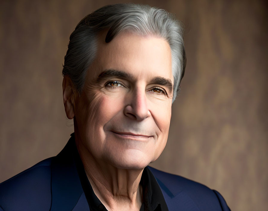 Elderly man in dark suit with gray hair and smile on textured background