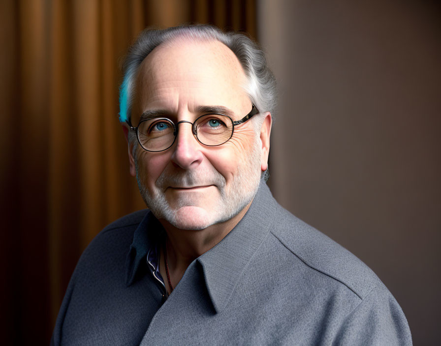 Smiling older man portrait with glasses and gray hair