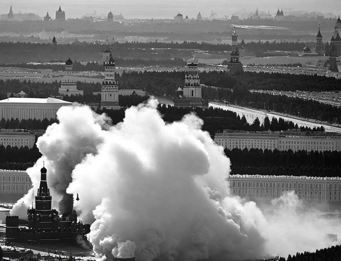 City skyline photo with large smoke plumes near buildings