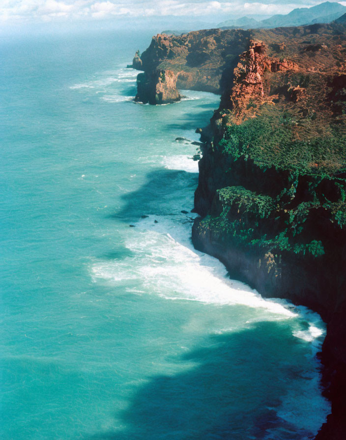 Scenic rugged coastline with turquoise sea and crashing waves