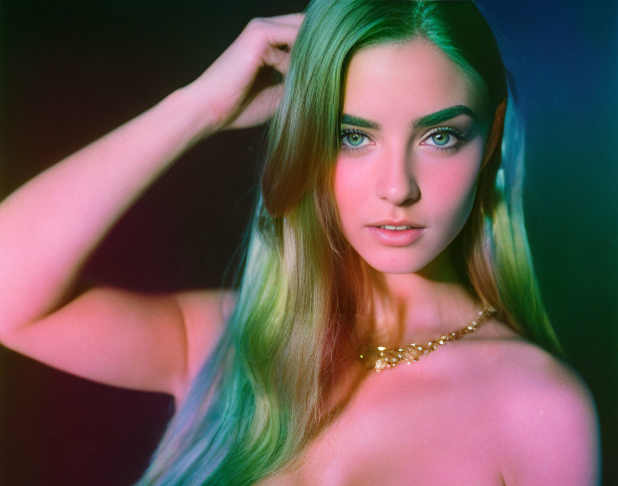 Portrait of woman with green-tinged hair and striking eyes in colorful lighting