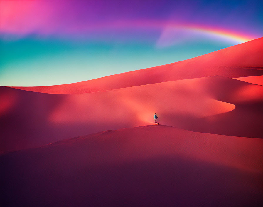 Vivid desert dune scene under pink and blue sky