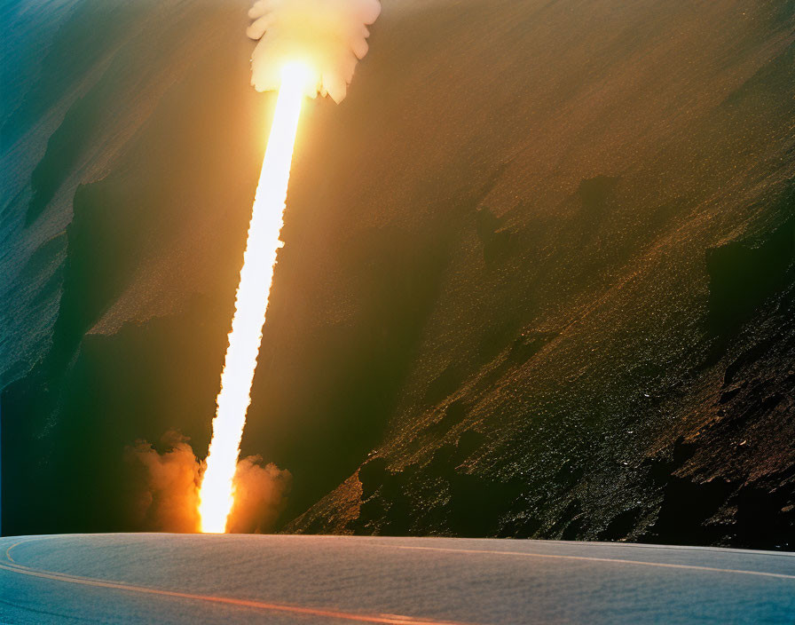 Fiery rocket launch over curved sunset horizon