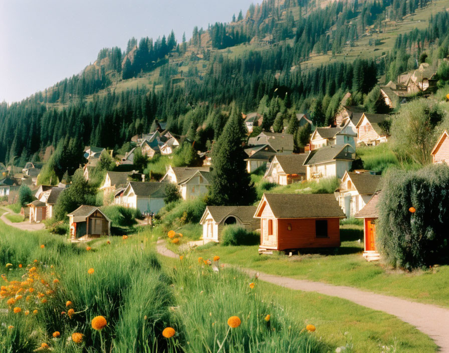 Scenic village with blooming flowers and forested hills