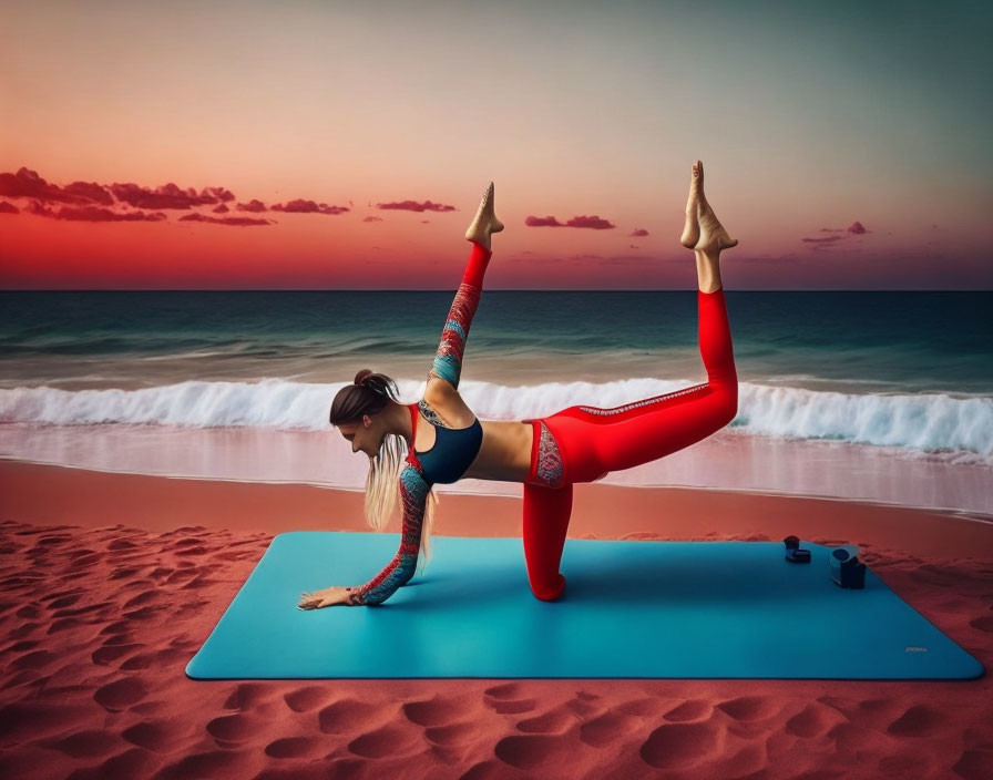 Yoga practitioner on beach mat at sunset in elevated leg pose