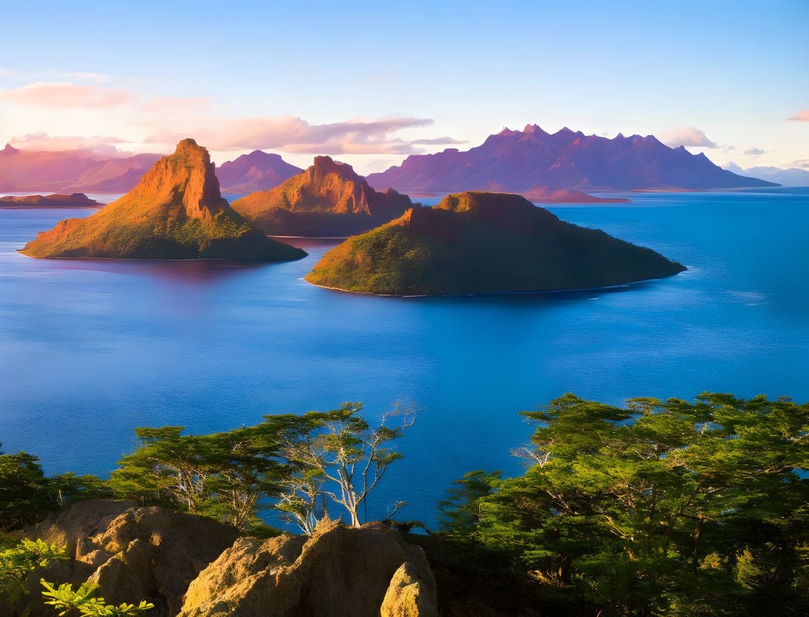 Serene blue bay with green islands and mountains at sunset