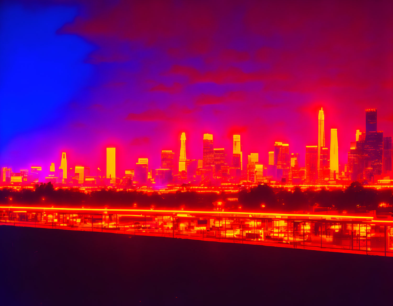 Twilight city skyline with red and blue thermal filter effect