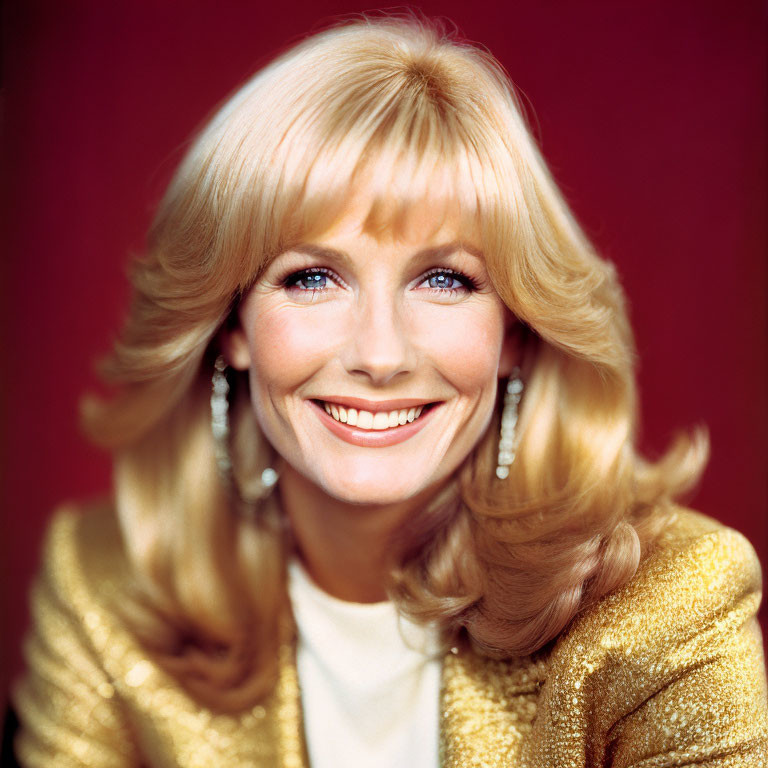 Blonde Woman Smiling in Gold Sequined Top on Red Background