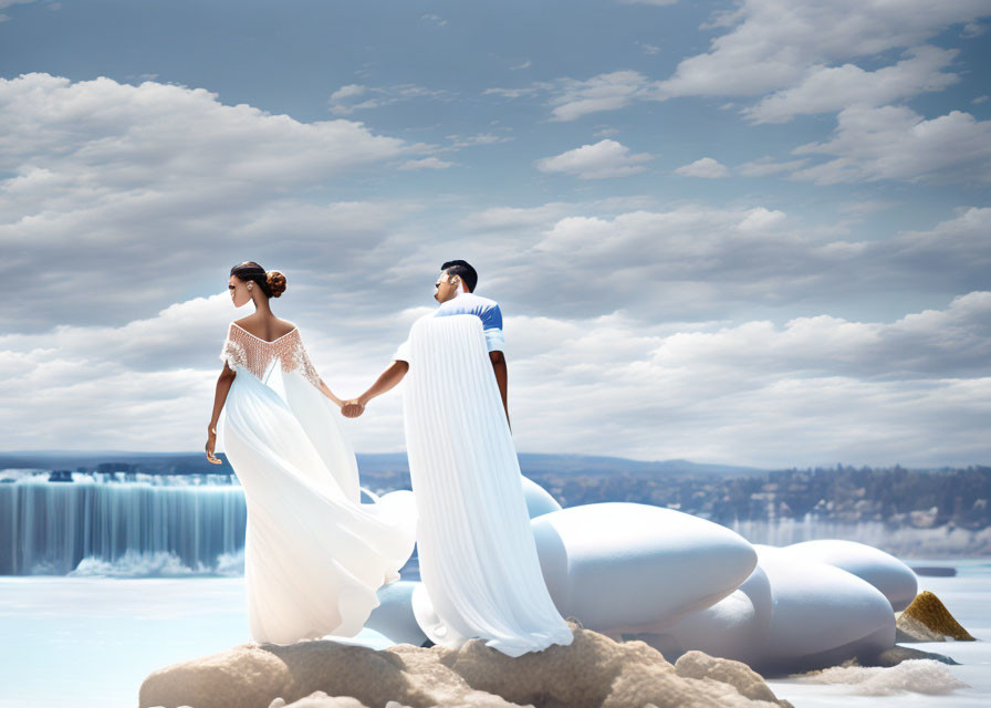 Couple in wedding attire on sandy shore with waterfall backdrop