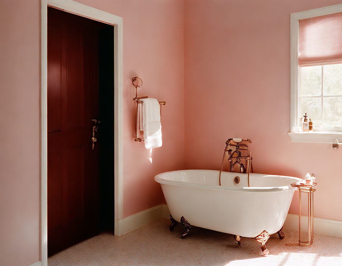 Vintage-Style Bathroom with Pink Walls and Claw-Foot Bathtub