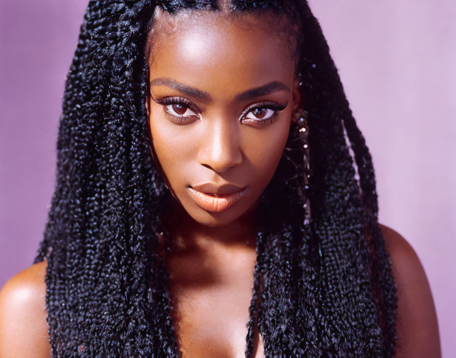 Portrait of woman with braided hair, captivating eyes, subtle makeup on lilac backdrop