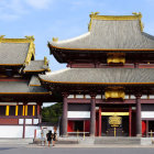 Traditional Japanese Temple with Golden Accents in Clear Sky