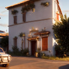 Charming old building with climbing plants in warm sunlight