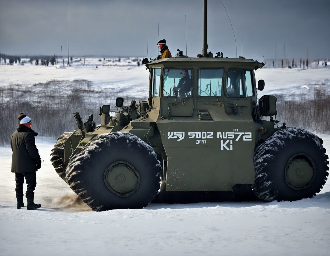 Military snow vehicle with large wheels in snowy landscape with person observing