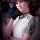 Contemplative woman in retro police uniform with badge and gloves