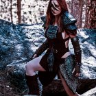 Red-haired woman in medieval warrior costume with sword among forest rocks